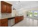 Bright kitchen featuring granite countertops, stainless steel appliances, and a lovely view of the backyard at 837 Sand Binder Dr., Myrtle Beach, SC 29579