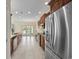 Open kitchen design with stainless steel appliances, granite counters, tile flooring and view of the outdoors at 837 Sand Binder Dr., Myrtle Beach, SC 29579