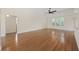 Spacious living room boasting wood floors, neutral walls, large windows, and a ceiling fan at 837 Sand Binder Dr., Myrtle Beach, SC 29579
