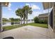 Outdoor patio area showcases a custom designed concrete space with waterfront views and landscaping at 837 Sand Binder Dr., Myrtle Beach, SC 29579