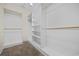Bright walk-in closet with white built in shelving and organization features at 837 Sand Binder Dr., Myrtle Beach, SC 29579