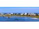 Picturesque coastal community featuring a wooden walkway and waterfront homes with ocean views at 9724 Indigo Creek Blvd., Murrells Inlet, SC 29576