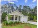 Charming single-story home with a manicured lawn, a cozy front porch and attached one car garage at 9724 Indigo Creek Blvd., Murrells Inlet, SC 29576