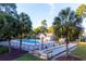 Community pool and bocce ball court surrounded by palm trees at 9724 Indigo Creek Blvd., Murrells Inlet, SC 29576