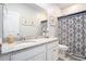 Well-lit bathroom with vanity, mirror, decorative accents, and a shower/tub combo with great features at 981 Mourning Dove Dr., Myrtle Beach, SC 29577