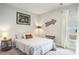 Comfortable bedroom with a bed, ample natural light from the window, and simple decor and design at 981 Mourning Dove Dr., Myrtle Beach, SC 29577