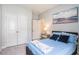 Comfortable bedroom with double door closet, carpet flooring, and a decorative painting at 981 Mourning Dove Dr., Myrtle Beach, SC 29577