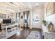 Bright home office with hardwood floors, modern desk, and ample natural light, creating an inspiring workspace at 981 Mourning Dove Dr., Myrtle Beach, SC 29577