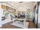 Spacious home office with hardwood floors, built-in bookshelves, and ample desk space, ideal for working from home at 981 Mourning Dove Dr., Myrtle Beach, SC 29577