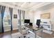 Well-lit home office features a stylish desk, comfortable chair, and large windows, creating a productive atmosphere at 981 Mourning Dove Dr., Myrtle Beach, SC 29577