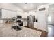 Bright, modern kitchen with stainless steel appliances, granite countertops, and white cabinets, ideal for cooking at 981 Mourning Dove Dr., Myrtle Beach, SC 29577