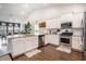 Modern kitchen featuring white cabinets, stainless steel appliances, and a spacious island with granite countertops at 981 Mourning Dove Dr., Myrtle Beach, SC 29577
