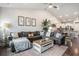 Spacious living room with large sectional sofa, stylish rug, and inviting decor with great flow at 981 Mourning Dove Dr., Myrtle Beach, SC 29577