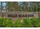 Entrance to Belle Harbor community featuring a brick sign and lush landscaping at 981 Mourning Dove Dr., Myrtle Beach, SC 29577