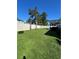 Large grassy backyard with a privacy fence and mature landscaping at 1039 Graybill Lane, North Myrtle Beach, SC 29582