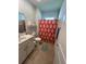 Bathroom featuring a double vanity, toilet, and a shower/tub with a red patterned curtain at 1039 Graybill Lane, North Myrtle Beach, SC 29582