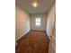 Bedroom featuring neutral walls, carpeted floors, a small window, and a white door at 1039 Graybill Lane, North Myrtle Beach, SC 29582