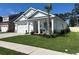 Charming single-story home with a well-manicured lawn, front porch, and attached garage at 1039 Graybill Lane, North Myrtle Beach, SC 29582