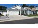 Charming single-story home boasts a manicured lawn and a two-car garage at 1039 Graybill Lane, North Myrtle Beach, SC 29582