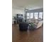 Bright living room featuring hardwood floors, lots of natural light, and a ceiling fan at 1039 Graybill Lane, North Myrtle Beach, SC 29582