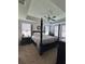 Spacious main bedroom with a ceiling fan, large windows, and a tray ceiling at 1039 Graybill Lane, North Myrtle Beach, SC 29582