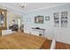 Inviting dining room with ample seating, beautiful wainscoting, and hardwood floors for elegant entertaining at 104 East Bay St., Georgetown, SC 29440