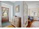 Foyer with a wooden cabinet, hardwood floors, and a view into the adjacent living area at 104 East Bay St., Georgetown, SC 29440