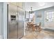 Spacious kitchen featuring stainless steel refrigerator and eat-in area with natural light at 104 East Bay St., Georgetown, SC 29440