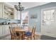 Charming eat-in kitchen with round wood table, blue walls, and ample natural light at 104 East Bay St., Georgetown, SC 29440