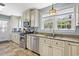 Well-equipped kitchen with stainless steel appliances, granite countertops, and plenty of natural light at 104 East Bay St., Georgetown, SC 29440