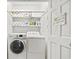 Efficient laundry room with washer, dryer, storage shelves, and ample supplies at 104 East Bay St., Georgetown, SC 29440