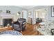 Charming living room showcasing hardwood floors, a fireplace, and views into other living spaces at 104 East Bay St., Georgetown, SC 29440
