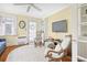Inviting sitting room with a large TV, patterned rug, and comfortable rocking chairs at 104 East Bay St., Georgetown, SC 29440