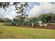 Community playground area with climbing structures and slides with green accents at 104 East Bay St., Georgetown, SC 29440