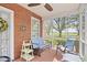 Cozy screened-in porch featuring comfortable blue seating and scenic views at 104 East Bay St., Georgetown, SC 29440