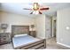 Bedroom showcases neutral decor, rustic bed and side tables, and ceiling fan at 109 Butkus Dr. # 2-1, Myrtle Beach, SC 29588
