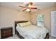 Bedroom with neutral walls, a window, and a comfortable bed with green and white patterned bedding at 109 Butkus Dr. # 2-1, Myrtle Beach, SC 29588