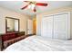 This bedroom features a dresser, a ceiling fan, and a closet with bi-fold doors at 109 Butkus Dr. # 2-1, Myrtle Beach, SC 29588