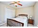Comfortable bedroom featuring a ceiling fan, two side tables, and warm, neutral walls at 109 Butkus Dr. # 2-1, Myrtle Beach, SC 29588