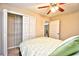 This bedroom features a ceiling fan, a closet with shelving, and neutral-toned walls at 109 Butkus Dr. # 2-1, Myrtle Beach, SC 29588