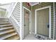 Exterior view of condo entrance with stairs and two doors at 109 Butkus Dr. # 2-1, Myrtle Beach, SC 29588