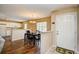 Open-concept living space with hardwood floors seamlessly connects dining and kitchen at 109 Butkus Dr. # 2-1, Myrtle Beach, SC 29588