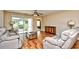 Comfortable living room featuring neutral walls, and sliding glass door for natural light at 109 Butkus Dr. # 2-1, Myrtle Beach, SC 29588