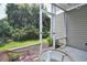 Enjoy outdoor living on this screened-in porch, with views of the lush backyard at 109 Butkus Dr. # 2-1, Myrtle Beach, SC 29588