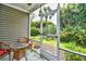 A screened porch with comfortable seating and views of the well-manicured backyard at 109 Butkus Dr. # 2-1, Myrtle Beach, SC 29588
