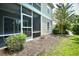View of screened porch with furniture, great view of surrounding greenery, attached to property at 109 Butkus Dr. # 2-1, Myrtle Beach, SC 29588