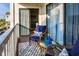 Inviting balcony featuring comfortable wicker furniture with a view of the neighborhood at 1212 Ocean Blvd. S # 202, Surfside Beach, SC 29575
