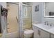 Bathroom with a white vanity, subway tile, glass shower door, and modern fixtures at 1212 Ocean Blvd. S # 202, Surfside Beach, SC 29575