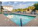 Community in-ground pool perfect for relaxation, complete with nearby lounge chairs and manicured landscaping at 1212 Ocean Blvd. S # 202, Surfside Beach, SC 29575