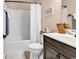 Bathroom featuring a vanity with dark cabinets, a toilet, and a bathtub with a white shower curtain at 1227 Cypress Shadow Ct., Murrells Inlet, SC 29576